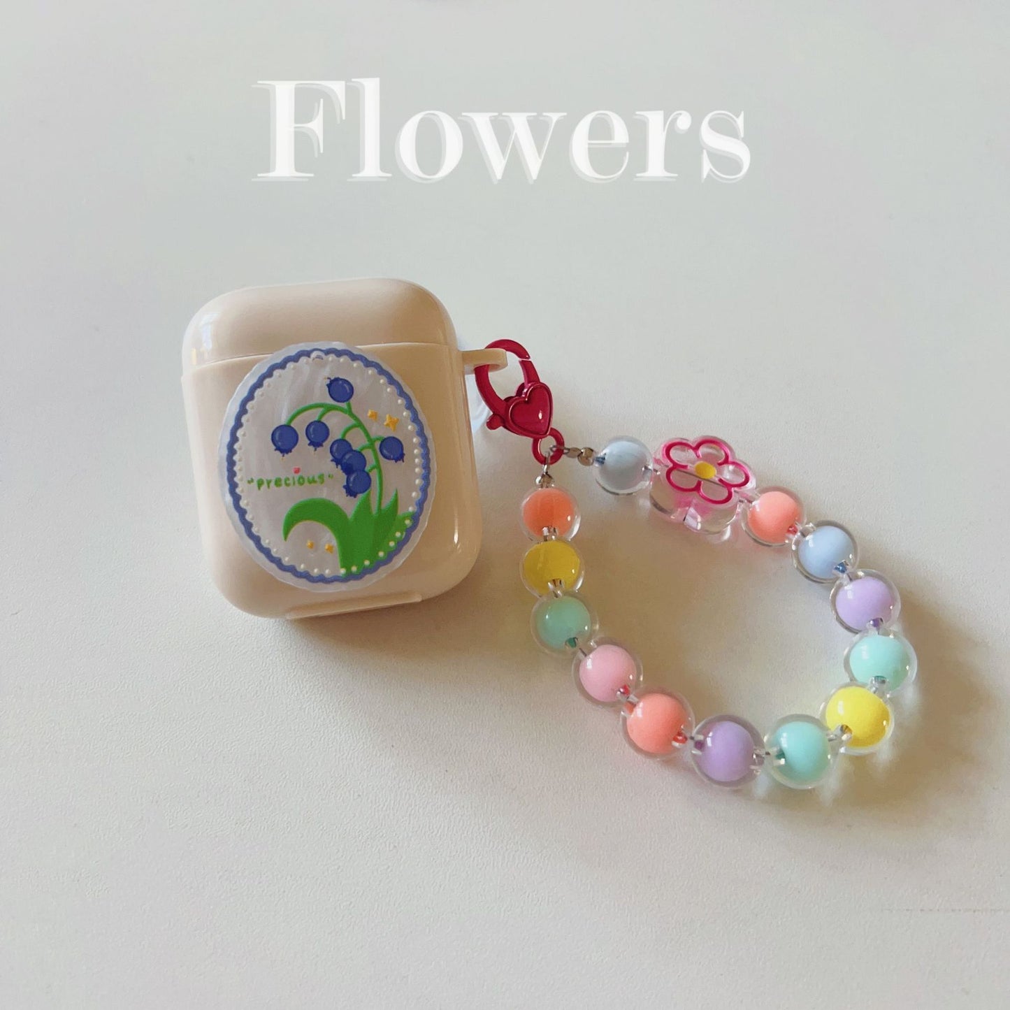 Floral patches + light blue base shell + blue bracelet AirPods Pro 2