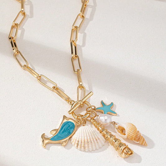 Gold Tone Paperclip Chain Toggle Necklace with Ocean Charms Dolphin Starfish and Seashell Pendant for Summer Beach Holiday